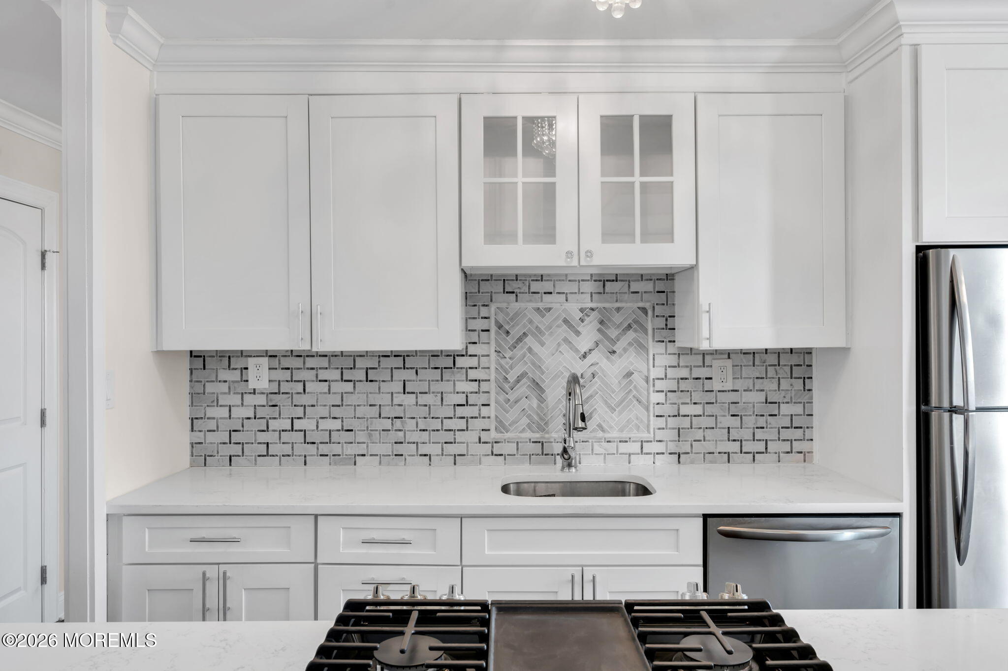 28 Riverside Avenue, Unit 10B Red Bank, NJ 07701 - Photo 6 of 24 a kitchen with stainless steel appliances cabinets and a counter top space