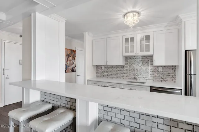 a kitchen with stainless steel appliances granite countertop a sink and cabinets