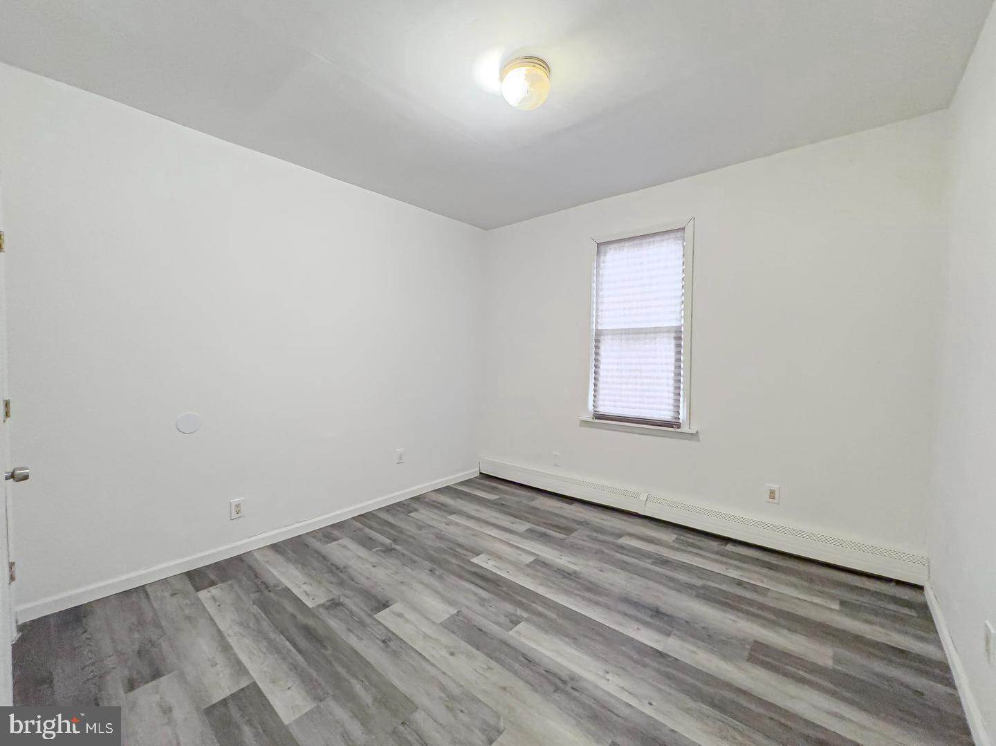 38 Broadway, Unit A Laurel Springs, NJ 08021 - Photo 5 of 10 an empty room with a window