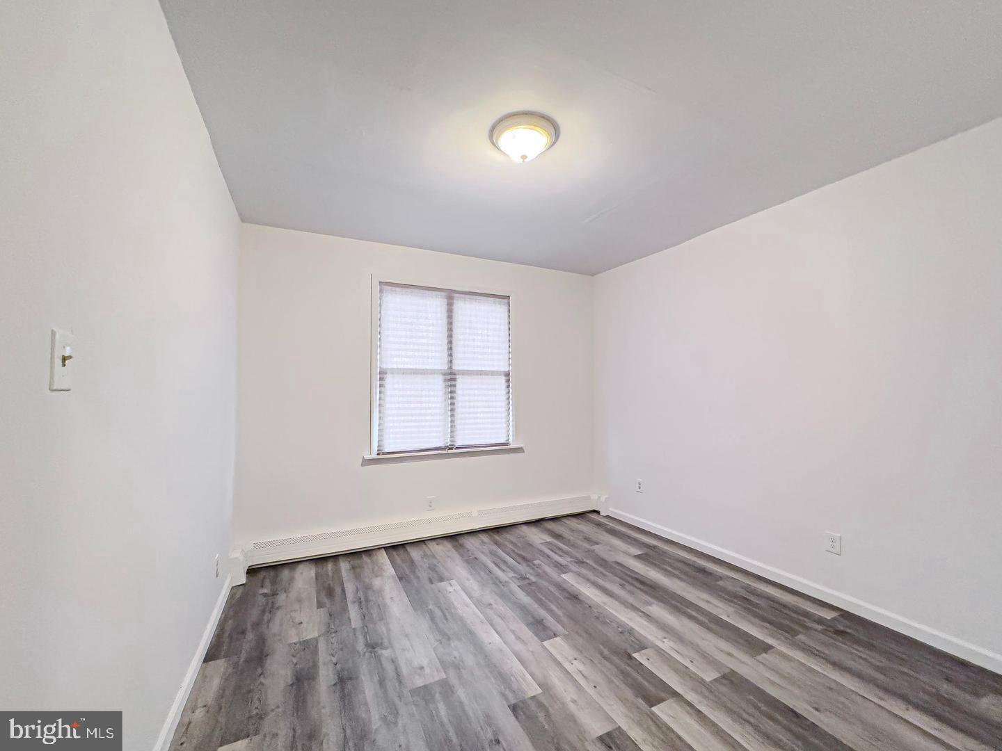 38 Broadway, Unit A Laurel Springs, NJ 08021 - Photo 7 of 10 an empty room with a window