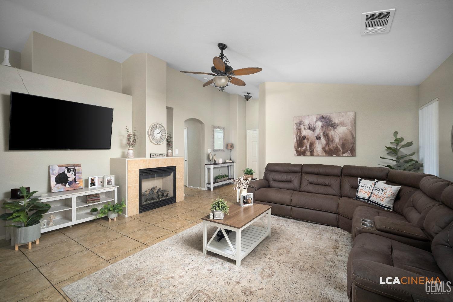 Undisclosed Address Bakersfield, CA 93311 - Photo 11 of 26 a living room with furniture and a flat screen tv