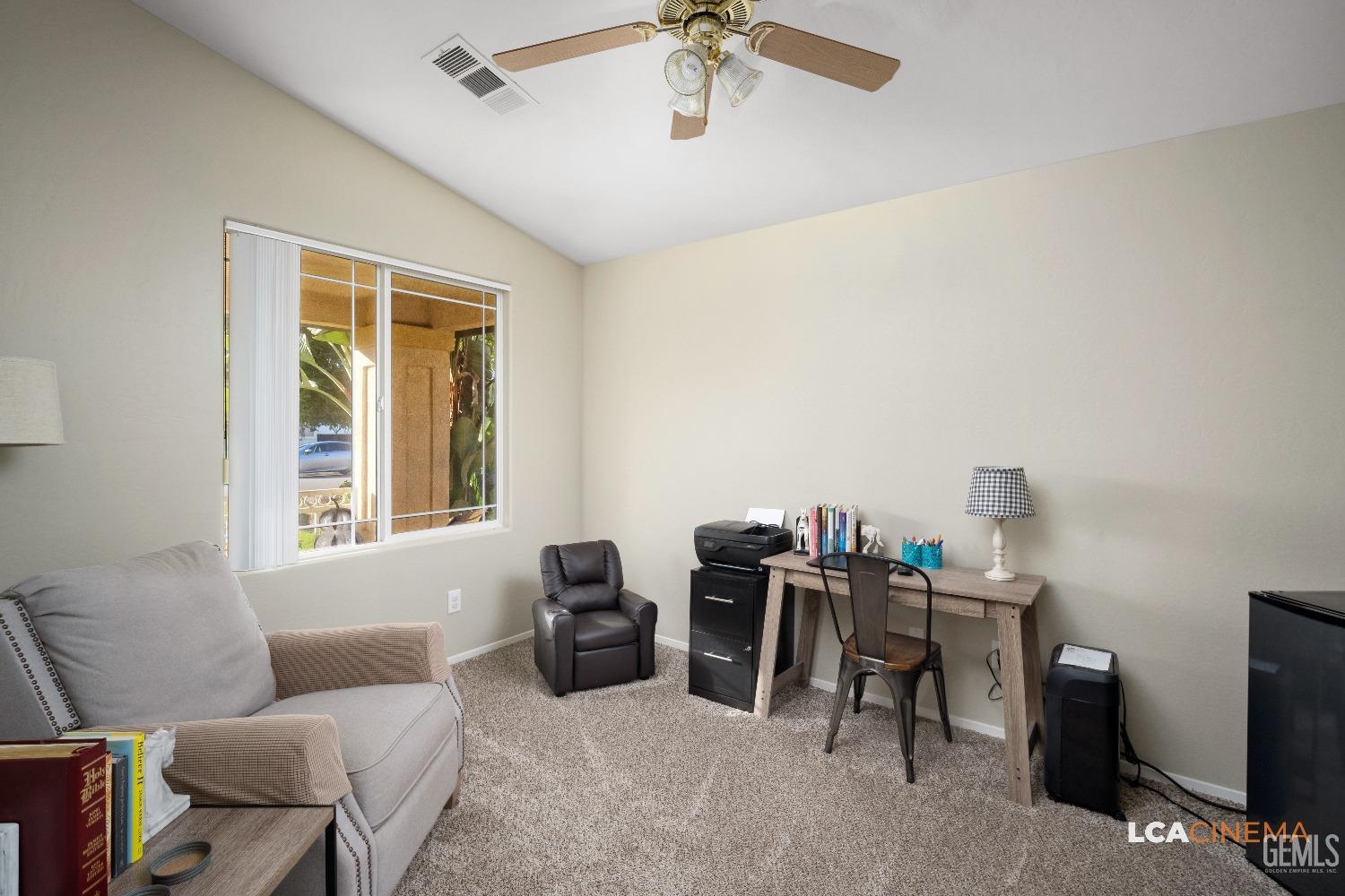 Undisclosed Address Bakersfield, CA 93311 - Photo 18 of 26 a living room with furniture and a window