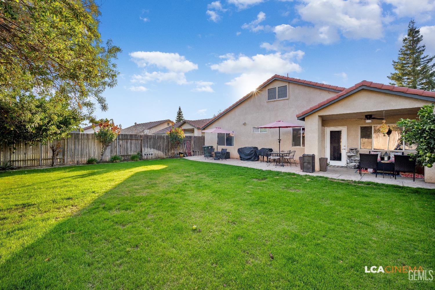 Undisclosed Address Bakersfield, CA 93311 - Photo 20 of 26 a view of a house with backyard porch and sitting area