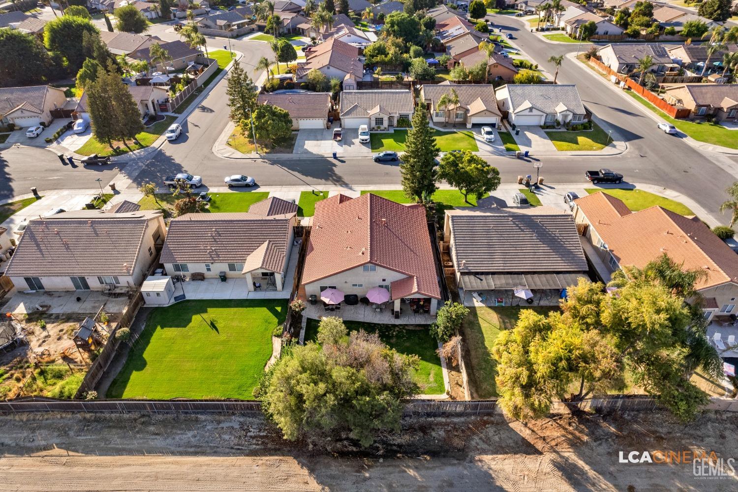 Undisclosed Address Bakersfield, CA 93311 - Photo 23 of 26 an aerial view of house with yard swimming pool and outdoor seating