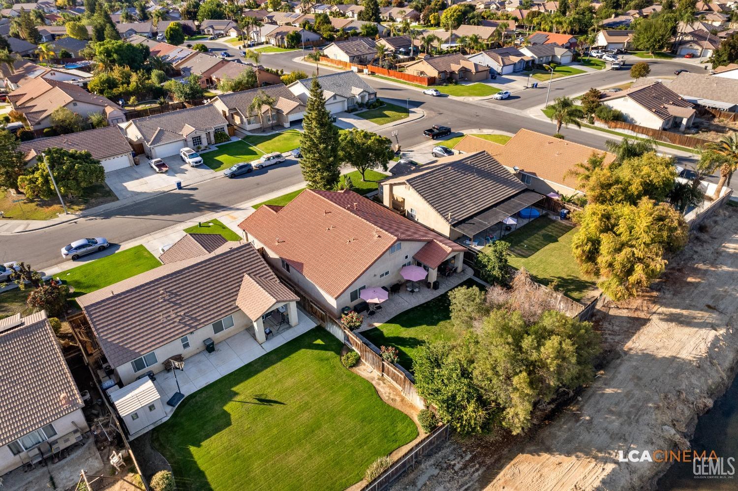 Undisclosed Address Bakersfield, CA 93311 - Photo 24 of 26 an aerial view of a house with a swimming pool yard and outdoor seating