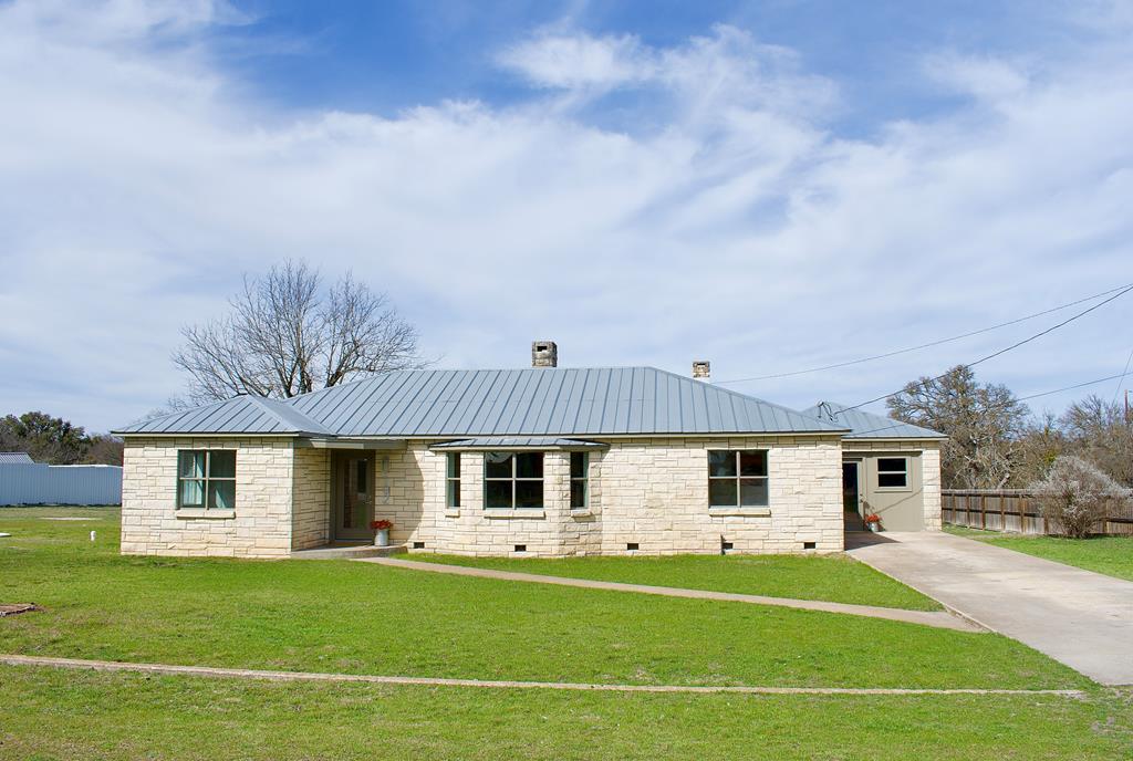 102 Myrtle Avenue Harper, TX 78631 - Photo 1 of 49 a front view of a house with a garden