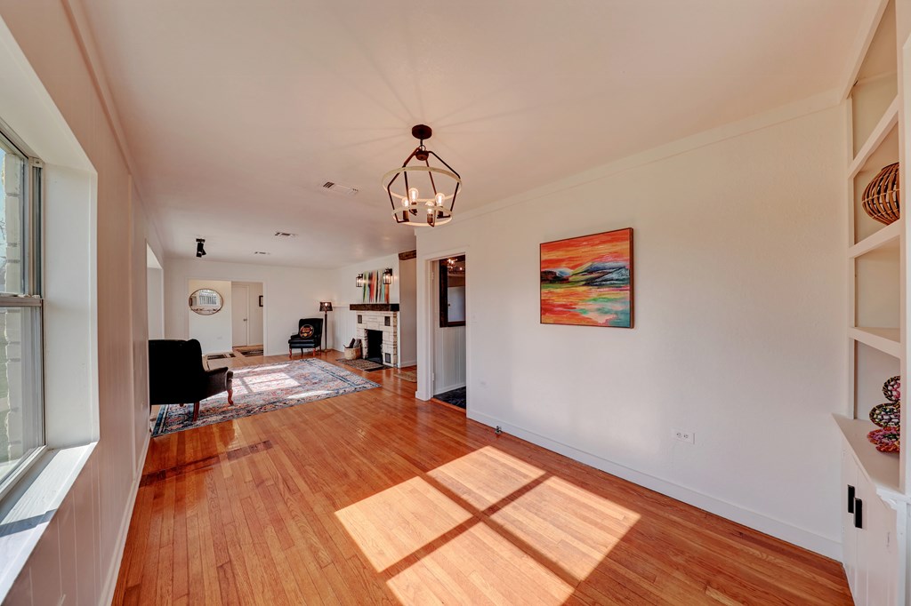 102 Myrtle Avenue Harper, TX 78631 - Photo 12 of 49 a bed room with a bed mirror and a window