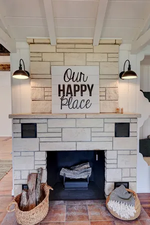 a kitchen with a fireplace and a stove