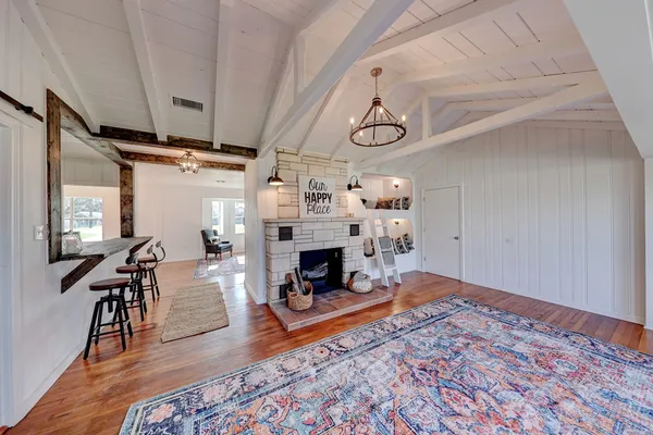 a living room with furniture and a fireplace