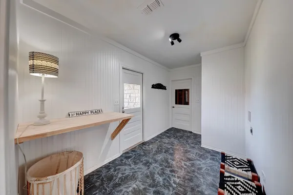 a kitchen with stainless steel appliances granite countertop a sink a stove and a refrigerator