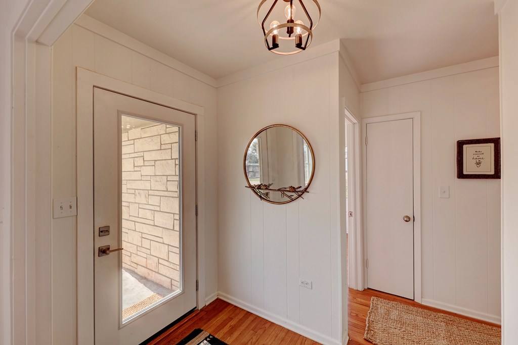 102 Myrtle Avenue Harper, TX 78631 - Photo 6 of 49 a view of a room with wooden floor fan and windows