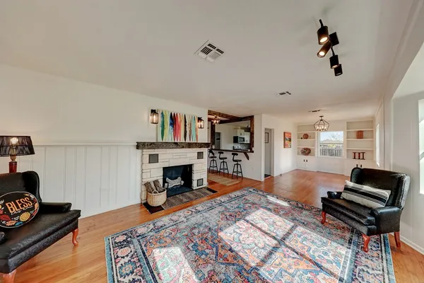 a living room with furniture and a fireplace