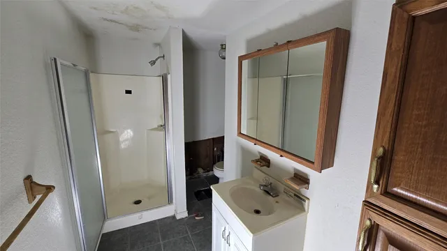 a view of a room with wooden floor