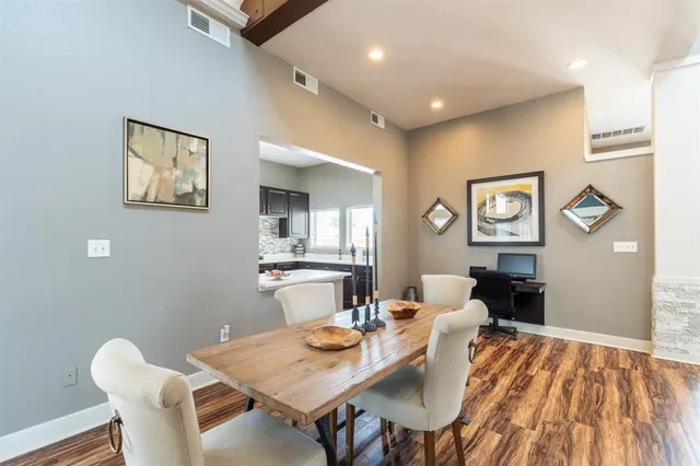 a kitchen with stainless steel appliances a sink stove and cabinets