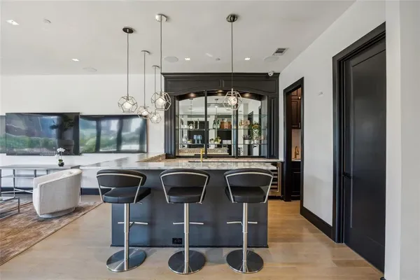 a kitchen with a table and chairs