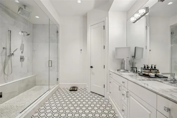 a bath room with a sink and a mirror