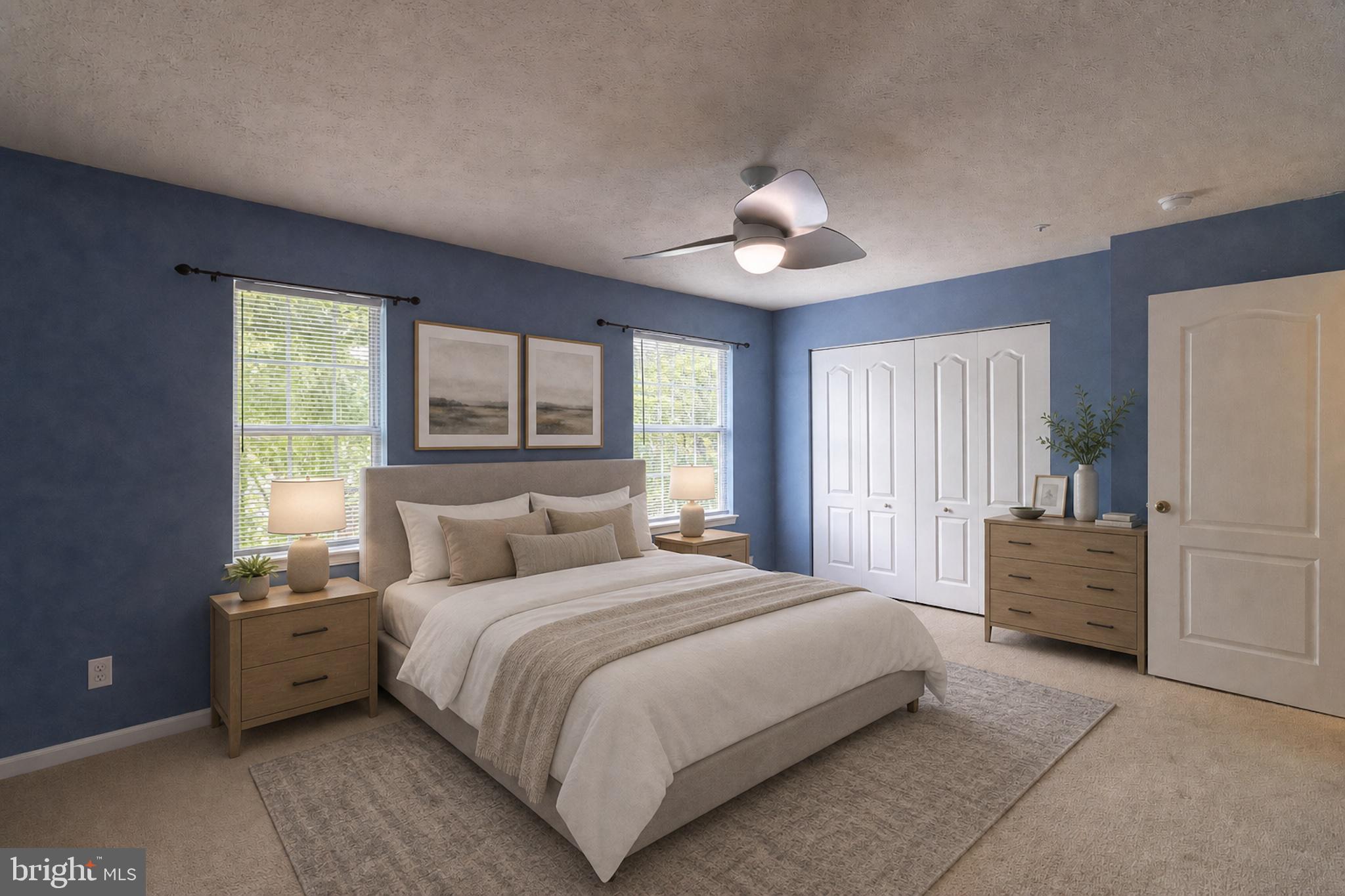 45292 Rumsford Lane California, MD 20619 - Photo 11 of 18 a bedroom with a large bed and a chandelier
