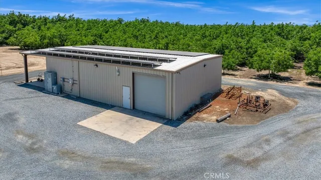 an aerial view of a house with a lake view