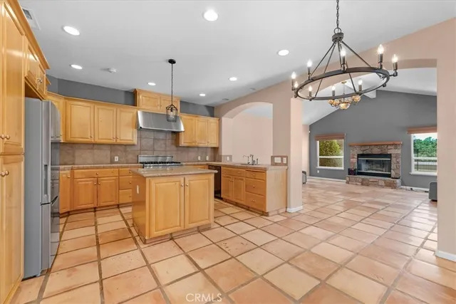 a spacious bathroom with a granite countertop sink a mirror and shower