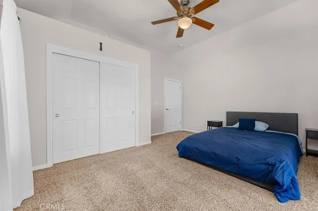 an empty room with furniture and windows