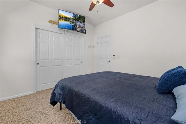 a view of a livingroom with furniture and a large window