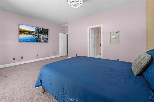 an aerial view of a house with a garden and a yard