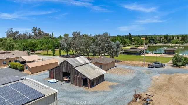 a view of a patio with a table and chairs