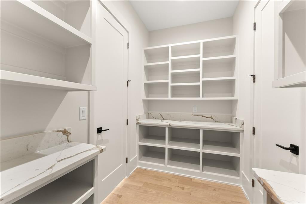 2021 Jones Phillips Road Dacula, GA 30019 - Photo 17 of 65 a view of a bedroom with a bed and a window