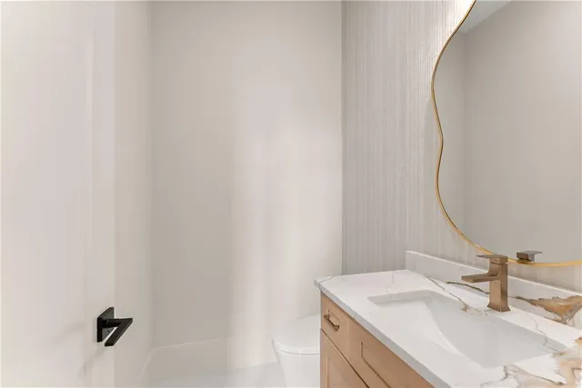 a view of an empty room with a fireplace and a window