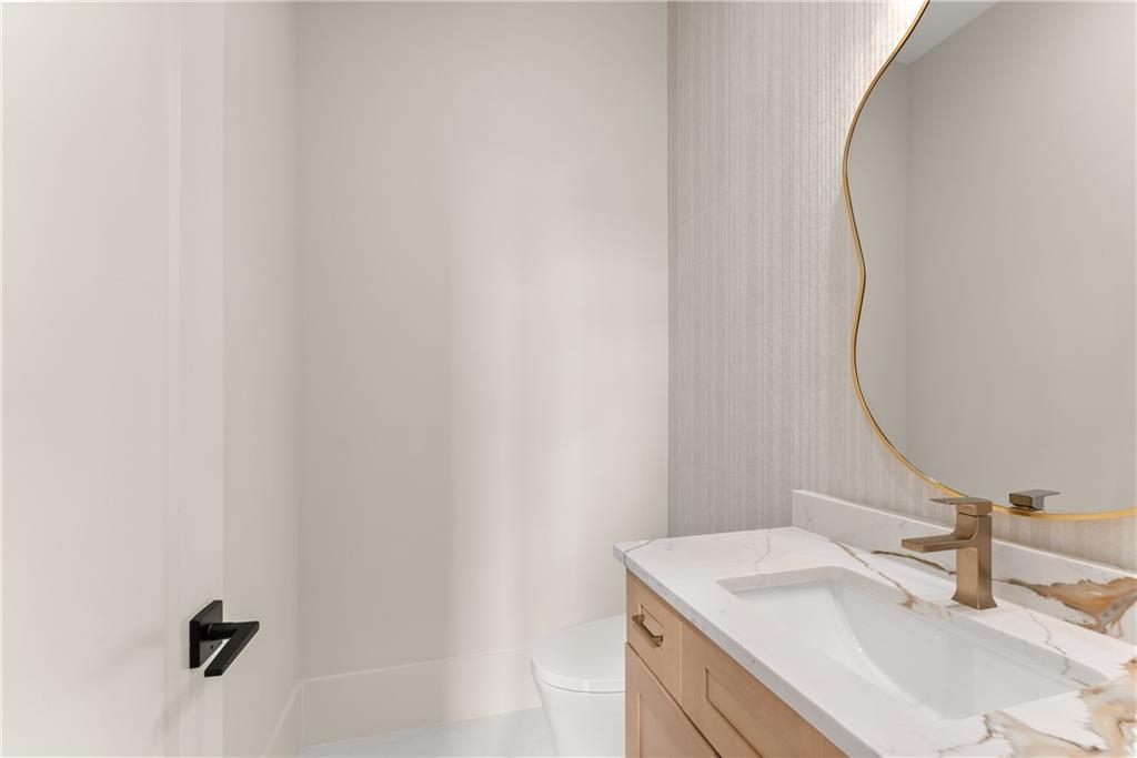 2021 Jones Phillips Road Dacula, GA 30019 - Photo 20 of 65 a bathroom with a sink and a mirror