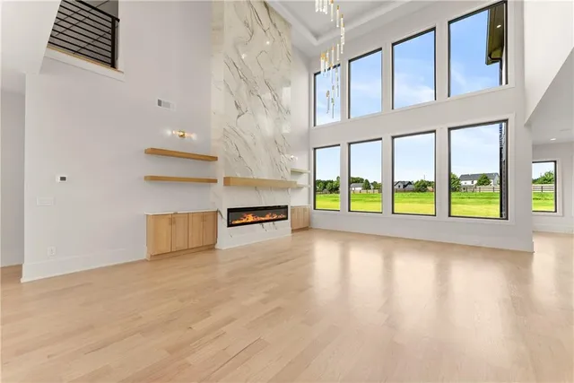 a large kitchen with stainless steel appliances kitchen island a large counter top