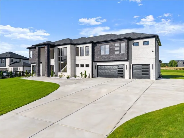 a view of a room with wooden floor and white walls
