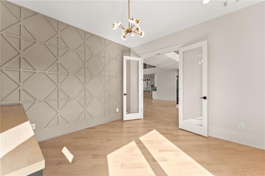 2021 Jones Phillips Road Dacula, GA 30019 - Photo 27 of 65 a view of a room with wooden floor and cabinet
