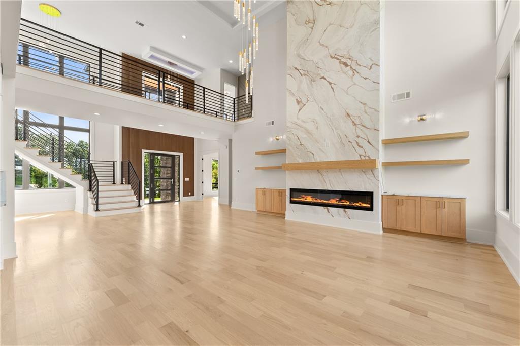 2021 Jones Phillips Road Dacula, GA 30019 - Photo 3 of 65 a view of an empty room with a fireplace and a window