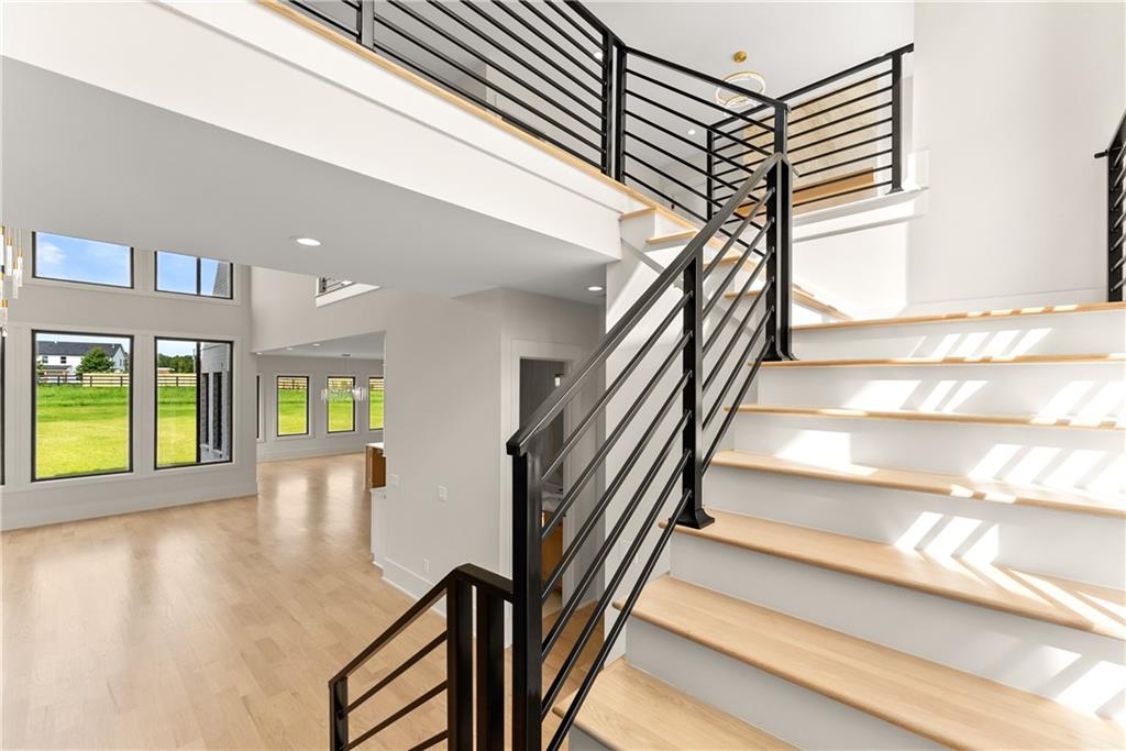 2021 Jones Phillips Road Dacula, GA 30019 - Photo 33 of 65 a view of entryway and hall with wooden floor