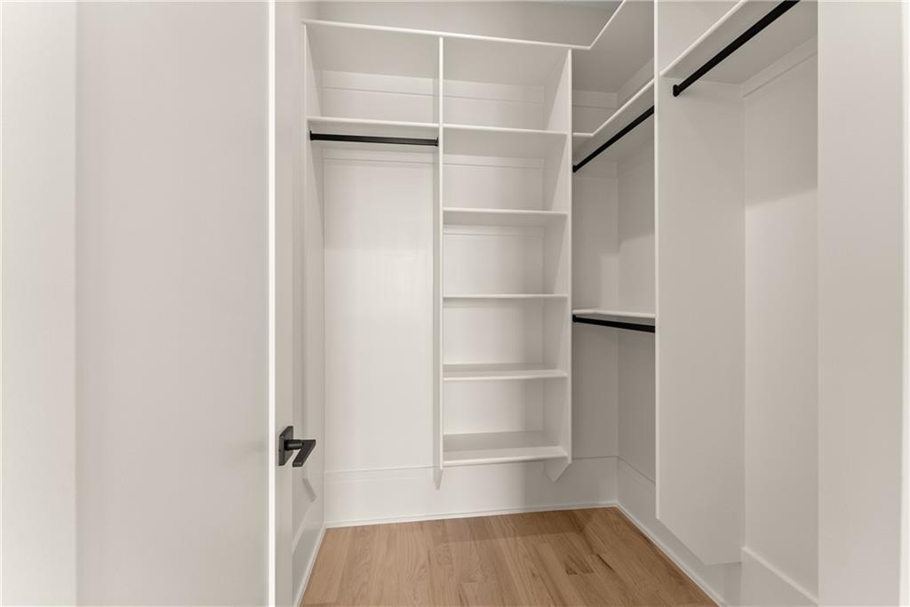 2021 Jones Phillips Road Dacula, GA 30019 - Photo 55 of 65 a view of walk in closet with empty racks