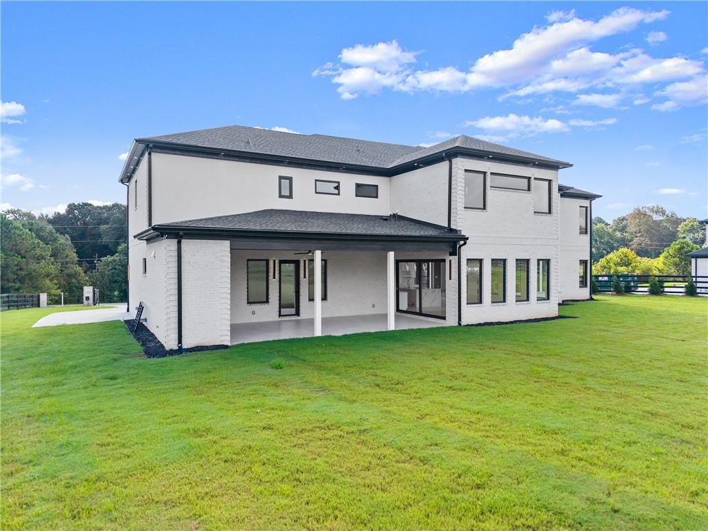 2021 Jones Phillips Road Dacula, GA 30019 - Photo 58 of 65 a view of a house with a garden