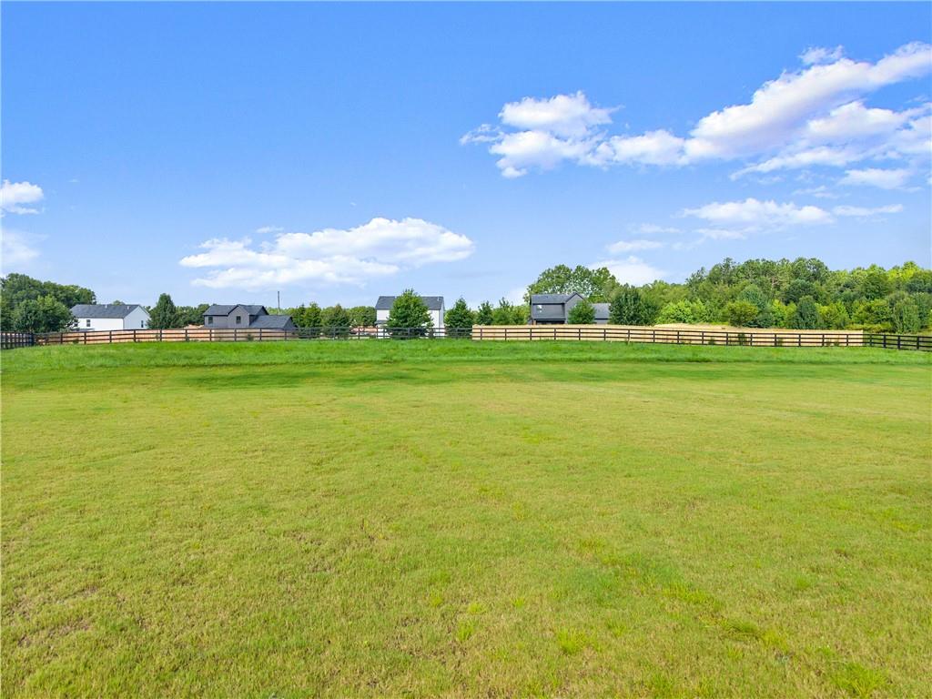 2021 Jones Phillips Road Dacula, GA 30019 - Photo 61 of 65 a view of a lake with a big yard