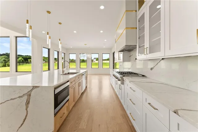 a view of a bedroom with a bed and a window