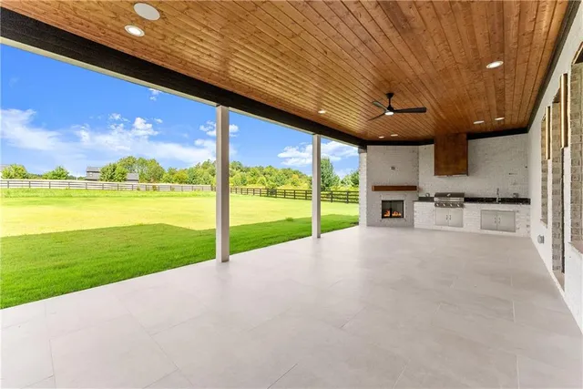 a view of a garden with a house in the background