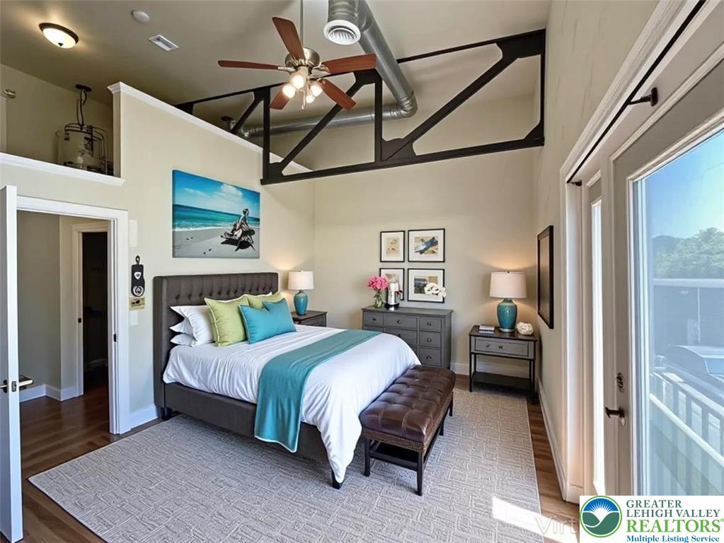 147 South 4th Street, Unit 14 Easton, PA 18042 - Photo 12 of 17 a bedroom with a bed and a chandelier