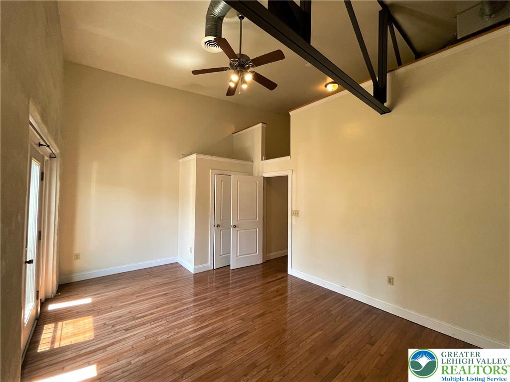 147 South 4th Street, Unit 14 Easton, PA 18042 - Photo 16 of 17 a view of a room with wooden floor and white walls