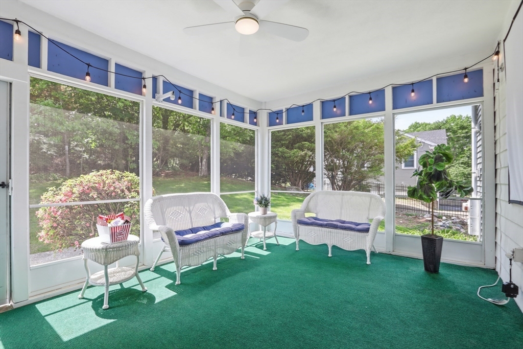 94 Johnson Road Winchester, MA 01890 - Photo 32 of 40 a living room with furniture and a floor to ceiling window
