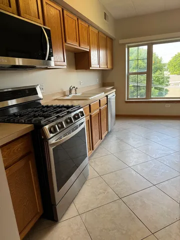 a kitchen with a stove and a microwave