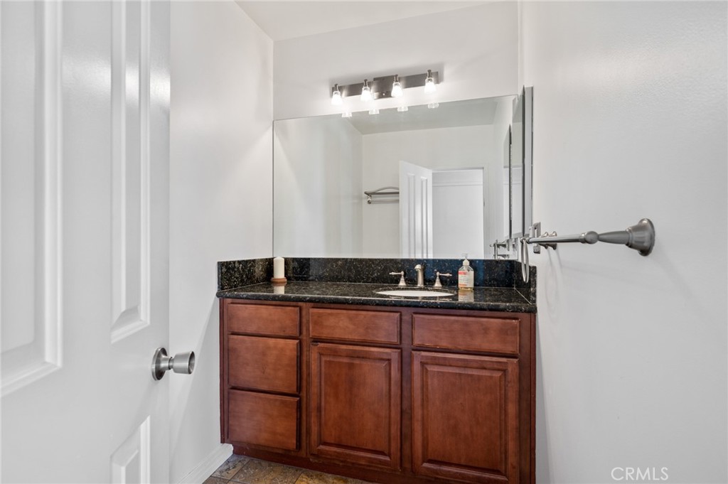 1863 Antioch Road Claremont, CA 91711 - Photo 28 of 46 a bathroom with a sink and a mirror