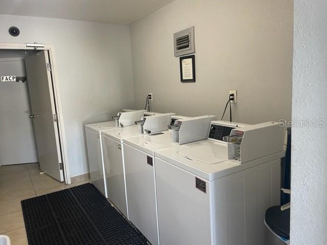 675 Indian Rocks Road North, Unit 108D Belleair Bluffs, FL 33770 - Photo 7 of 10 a utility room with dryer and washer