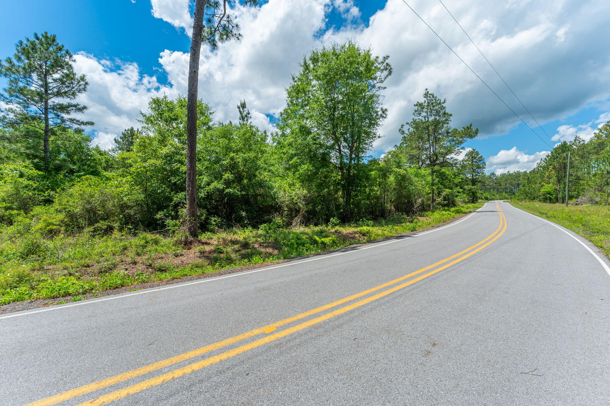 11 Sandy Ramp Road DeFuniak Springs, FL 32433 - Photo 25 of 25 a view of a road with a yard