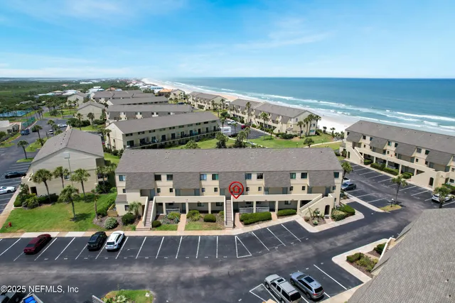 an aerial view of a yard with table and chairs