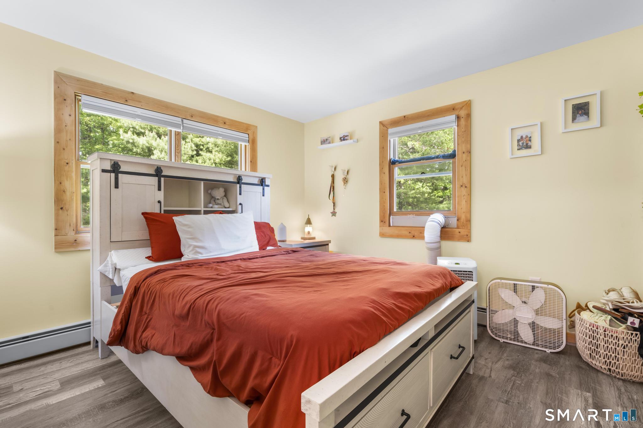 13 Christy Hill Road Ledyard, CT 06335 - Photo 18 of 38 a bed sitting in a bedroom next to a window