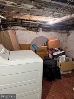 a utility room with washing machine